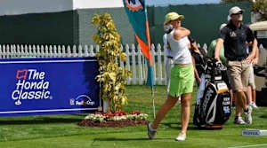 Kelly Okun tees off at the 2011 Honda Classic pro-am
